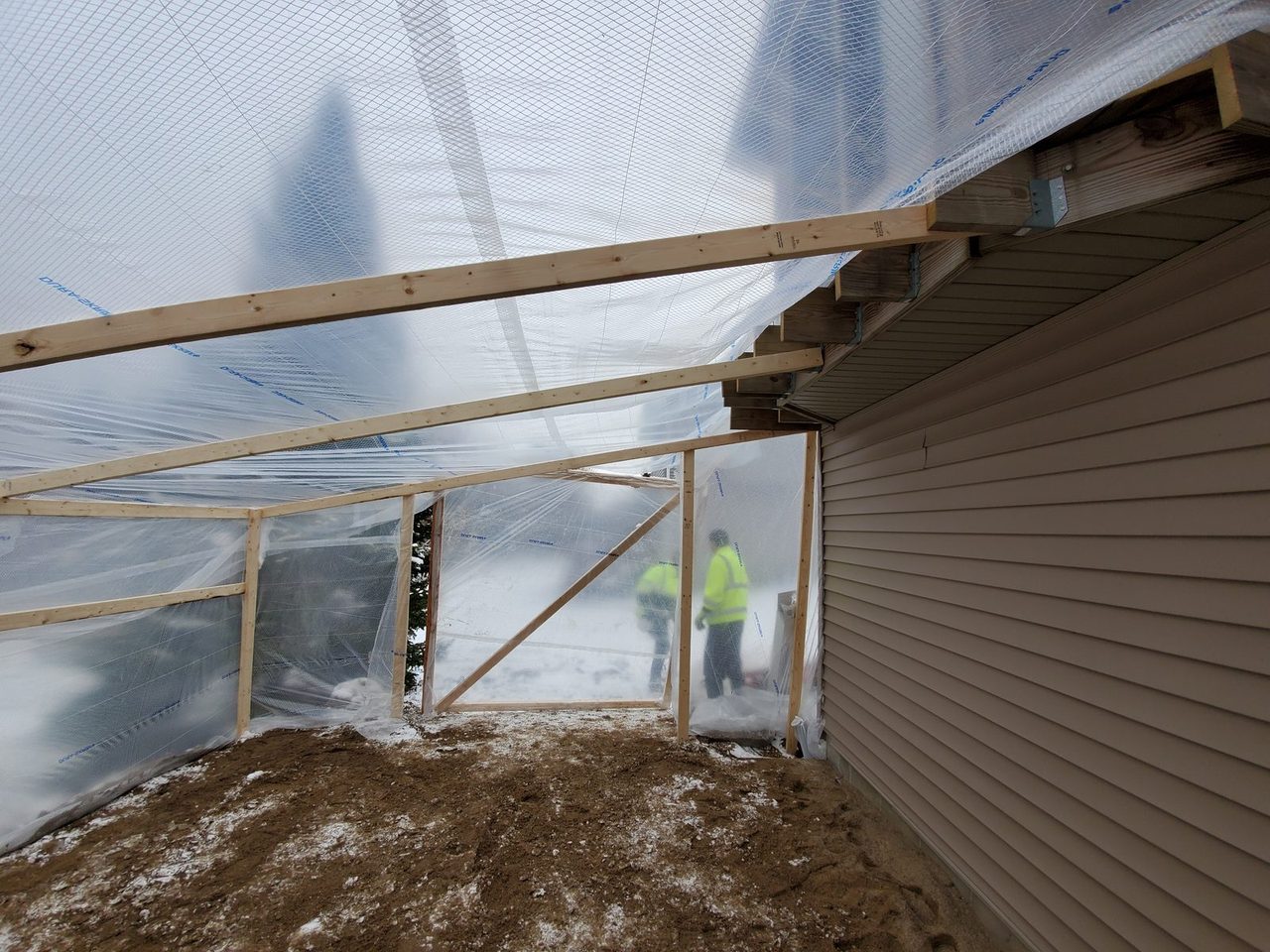 Temporary enclosure built for a late-fall concrete pour on a three-season porch in Lakeville, MN